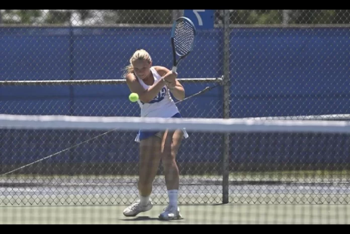 ec glass girls tennis tovia carothers competing in a high school tennis match